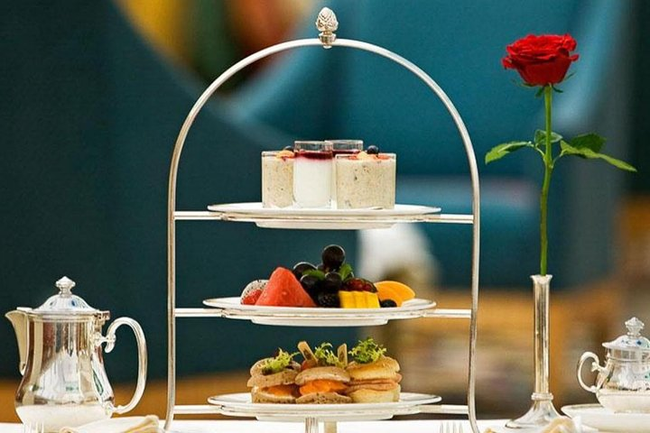 Indulge in a delightful high tea experience with stunning views of Dubai's skyline. Savor luxurious bites as you soak in the elegance of Burj Al Arab and the Burj Khalifa.